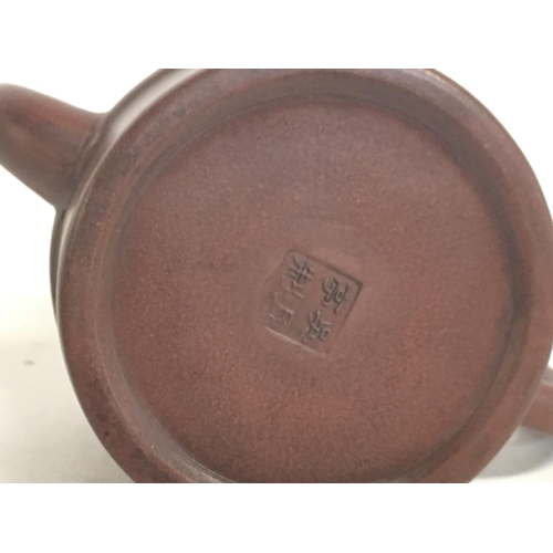 816 - A Chinese Terracotta tea pot and a reproduction bowl. This lot cannot be posted