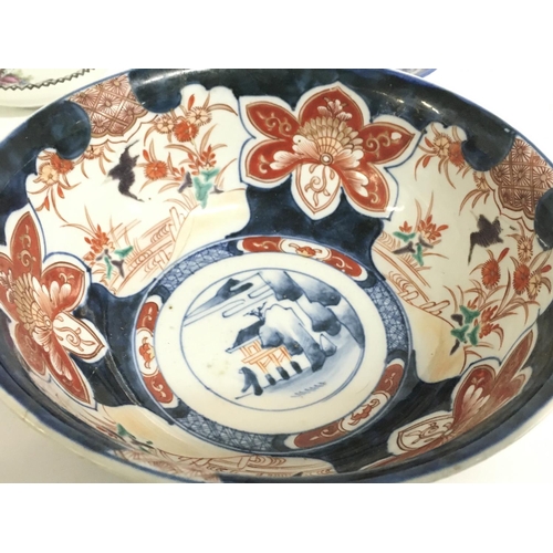 820 - A Japanese Imari bowl, Chinese Famille Rose dish, Chinese Blue and white ginger jar, Chinese blue an... 