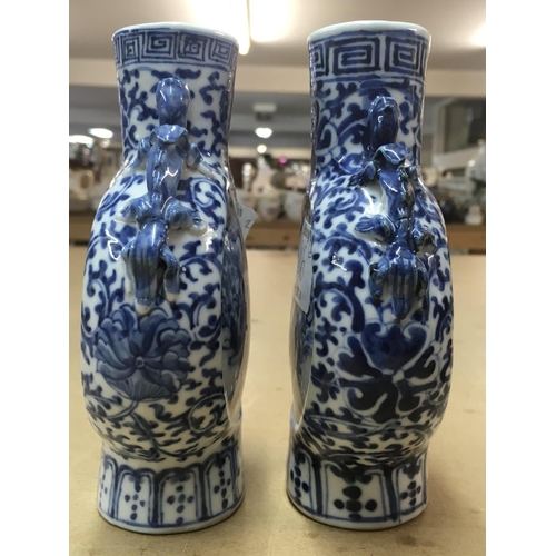 826 - A matched pair of 19th Century blue and white moon vases decorated with figures on horseback. Measur... 