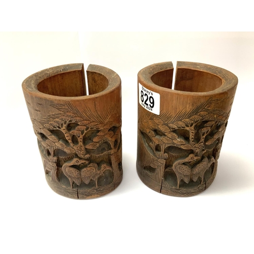 829 - 2 Chinese bamboo brush pots together with a carved Chinese bamboo junk. (C).