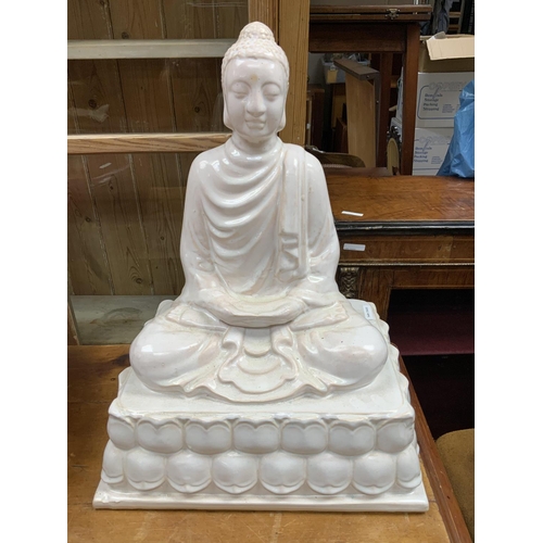 835 - A large modern ceramic figure of Buddha. 54cm x 41cm x 32cm