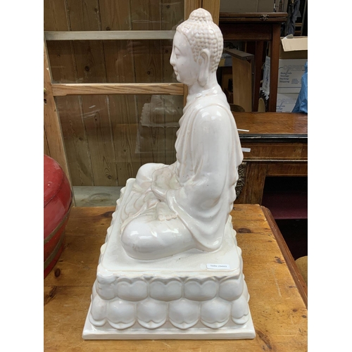 835 - A large modern ceramic figure of Buddha. 54cm x 41cm x 32cm