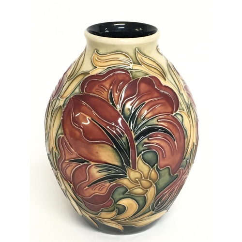 907 - A Moorcroft Spanish vase. 14cm tall. No obvious damage or restoration, this lot cannot be posted.