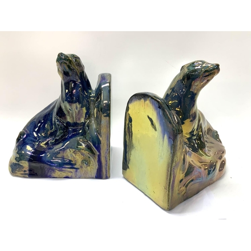 915 - A pair of Art Deco bookends in the form of two ceramic basking seals by Alphonse CytÃ¨res (1851-1941... 