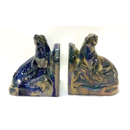 915 - A pair of Art Deco bookends in the form of two ceramic basking seals by Alphonse CytÃ¨res (1851-1941... 