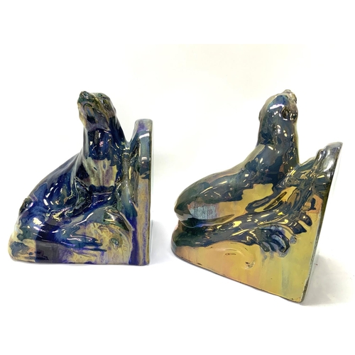 915 - A pair of Art Deco bookends in the form of two ceramic basking seals by Alphonse CytÃ¨res (1851-1941... 