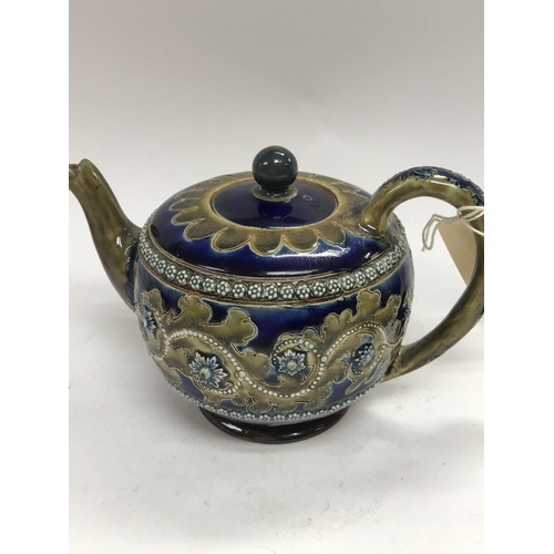 918 - A Royal Doulton George Tinworth teapot decorated with raised flower heads 12 cm .