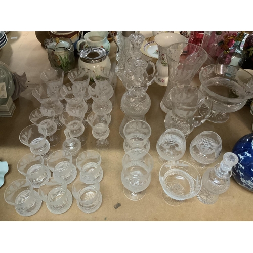 954 - A large collection of Edinburgh cut crystal Thistle design, 28pcs. (3 Decanters, Fruit Bowl, Vase, 2... 