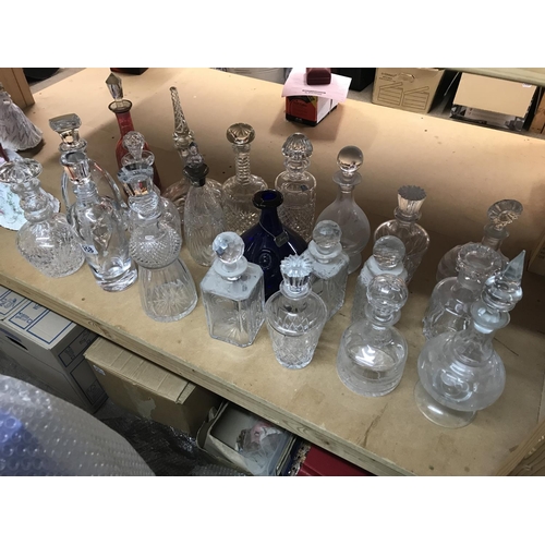 958 - A collection of mixed decanters including some collared and cut glass examples. Approximately 21deca... 