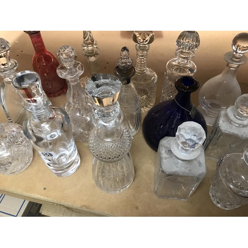 958 - A collection of mixed decanters including some collared and cut glass examples. Approximately 21deca... 