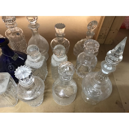 958 - A collection of mixed decanters including some collared and cut glass examples. Approximately 21deca... 