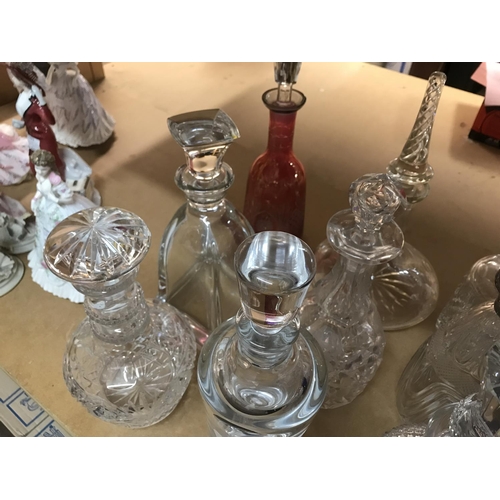 958 - A collection of mixed decanters including some collared and cut glass examples. Approximately 21deca... 