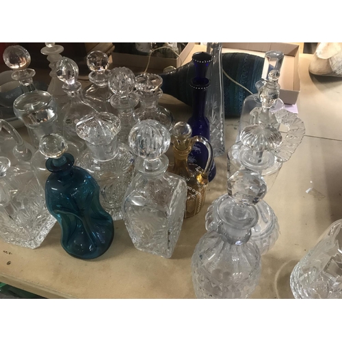 960 - A collection of decanters including some cut glass and coloured glass examples. Approximately 21 dec... 