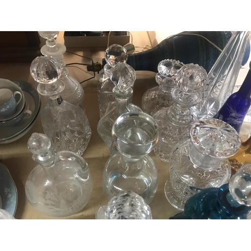 960 - A collection of decanters including some cut glass and coloured glass examples. Approximately 21 dec... 