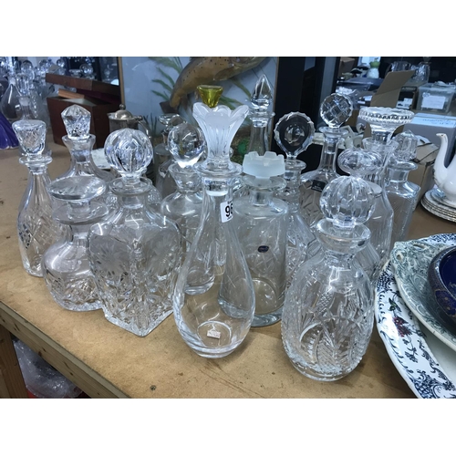 967 - A large collection of decanters including some glass cut and silver plated examples. Approximately 2... 