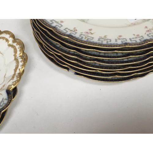 970 - A French Porcelain dinner service and a quantity of porcelain cups a d saucers.