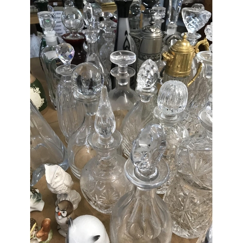 983 - A large collection of cut glass decanters. Approx 20 decanters.