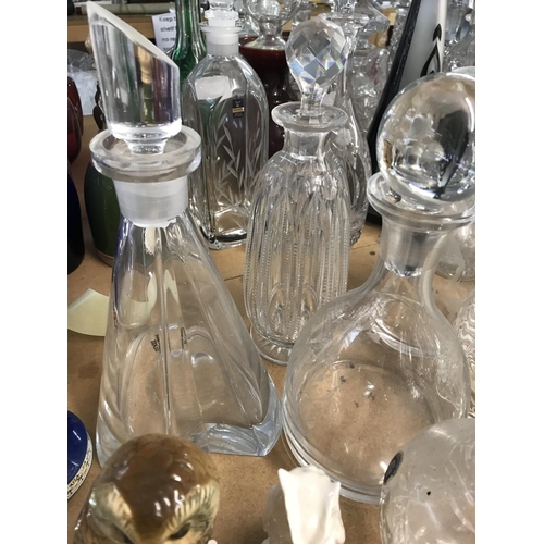 983 - A large collection of cut glass decanters. Approx 20 decanters.