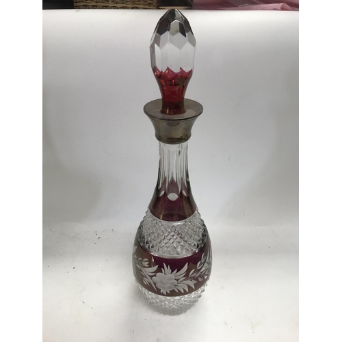 984 - An unusual 19th century cut glass silver collared lockable decanter with another fancy cut glass sil... 