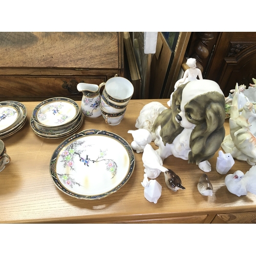 1135 - A large collection of mixed ceramics items including part tea set royal Doulton figurines a resin do... 