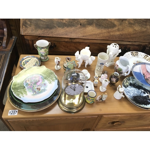 1136 - A collection of assorted ceramics including plates vases etc and a clock.
Postage D