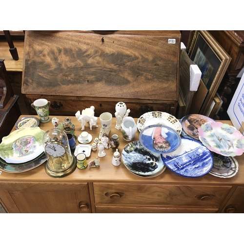 1136 - A collection of assorted ceramics including plates vases etc and a clock.
Postage D