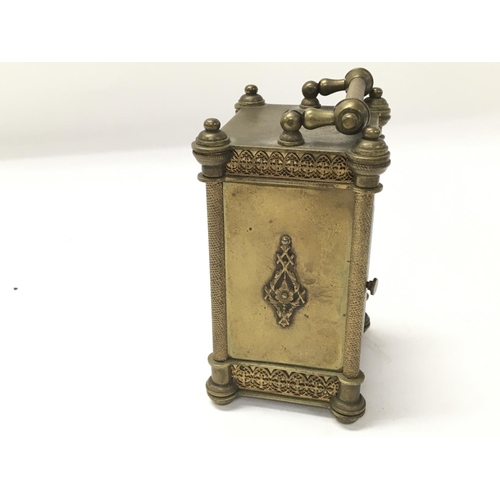 805 - A vintage carriage clock. 11cm by 6cm.