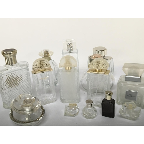 810 - A collection of quality Lalique and other designer glass scent bottles.