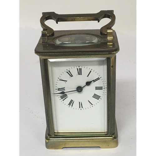 811 - A brass cased carriage CVL with key and seen working. NO RESERVE