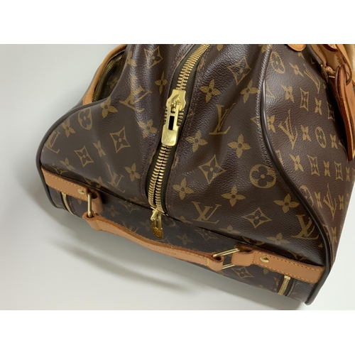 828 - A vintage Louis Vuitton travel case Eole 60 Monogram, with dust bag. (A)