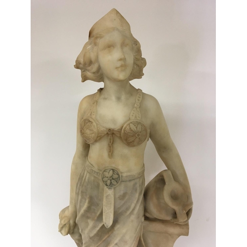 843 - A Quality Art Deco carved Carrera Marble figure a full length lady of Art Deco dress and with Neo cl... 