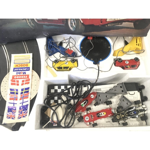 121 - A Boxed Scalextric Mini Racing Set. With Extra Cars. (2). No Reserve.