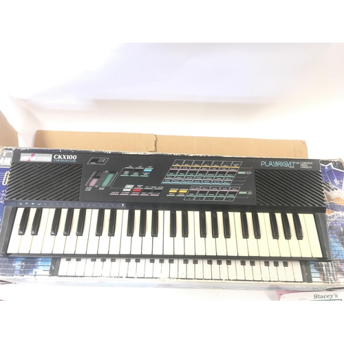 129 - A Boxed Amstrad CKX100 Keyboard. Box Is Worn.