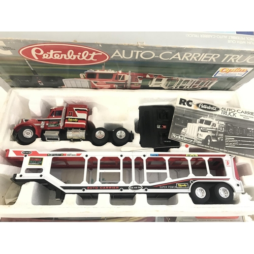 141 - A Boxed Remote Truck and a Matchbox Power Track. (2).