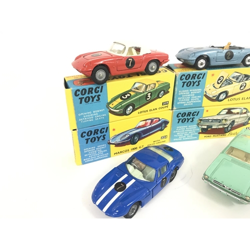 165 - 7 X Boxed Corgi Vehicles. A Lotus Elan Coupe #319. A Lotus Elan S2 #318 A/F. A Marcos 1800 G.T. #324... 