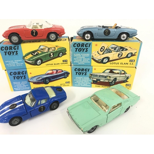 165 - 7 X Boxed Corgi Vehicles. A Lotus Elan Coupe #319. A Lotus Elan S2 #318 A/F. A Marcos 1800 G.T. #324... 