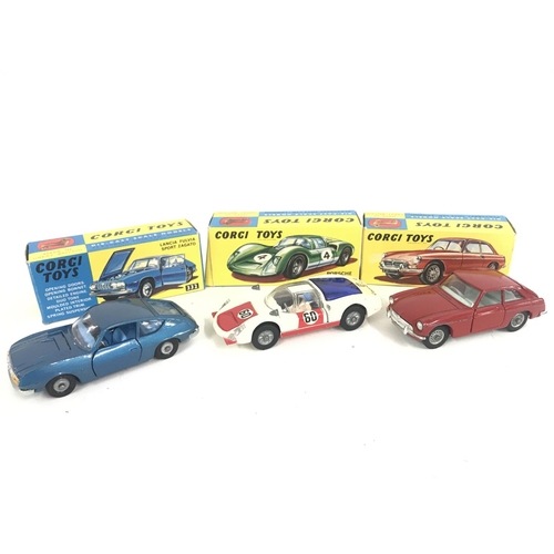 165 - 7 X Boxed Corgi Vehicles. A Lotus Elan Coupe #319. A Lotus Elan S2 #318 A/F. A Marcos 1800 G.T. #324... 