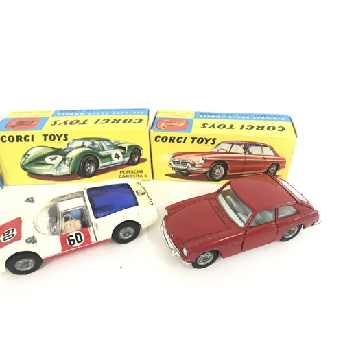 165 - 7 X Boxed Corgi Vehicles. A Lotus Elan Coupe #319. A Lotus Elan S2 #318 A/F. A Marcos 1800 G.T. #324... 