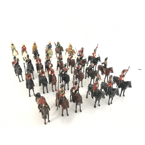 259 - A Collection of Vintage Britains. 6 Mounted Indians and a Cavalry. And Assorted Mounted Lancers. (2)... 