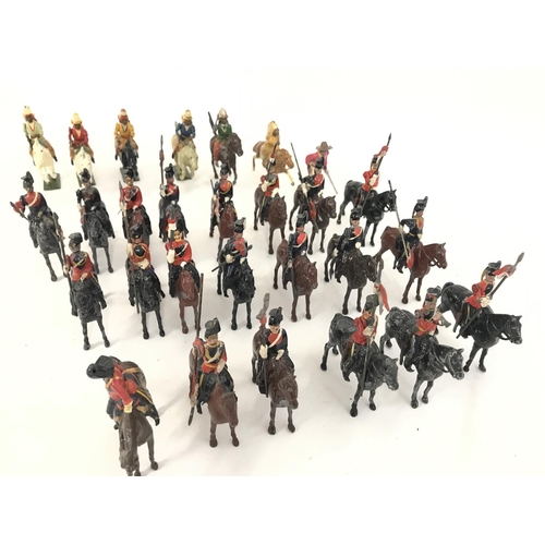 259 - A Collection of Vintage Britains. 6 Mounted Indians and a Cavalry. And Assorted Mounted Lancers. (2)... 