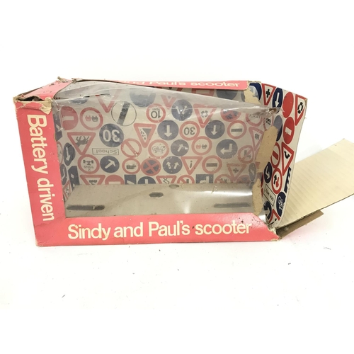 283 - A Boxed Pedigree Battery Driven Sindy and Pauls Scooter. Box Is Worn.