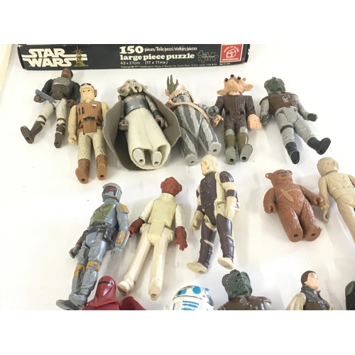 30 - A collection of vintage Star Wars figures..card backs..jigsaw