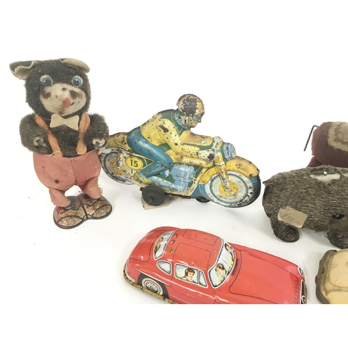 368 - A Collection of Worn Tinplate Toys. Including a Mickey Mouse Money Box. NO RESERVE