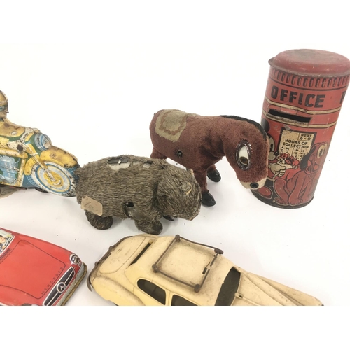 368 - A Collection of Worn Tinplate Toys. Including a Mickey Mouse Money Box. NO RESERVE