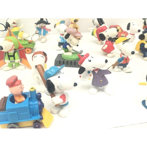 376 - A collection of 30 Collectable Snoopy figures of varying ages. NO RESERVE