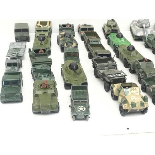 380 - A collection in excess of 30 Playworn model vehicles by Matchbox..Corgi and others. Theme is Militar... 