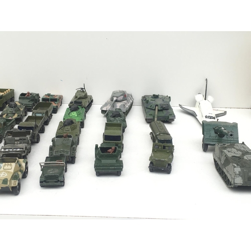 380 - A collection in excess of 30 Playworn model vehicles by Matchbox..Corgi and others. Theme is Militar... 