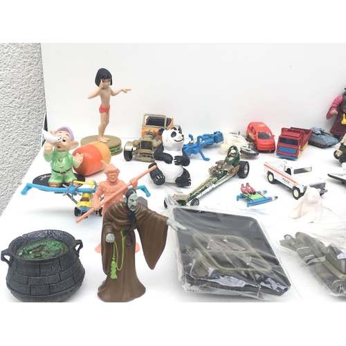 381 - An assorted collection of items including animals, vehicles and figures. NO RESERVE