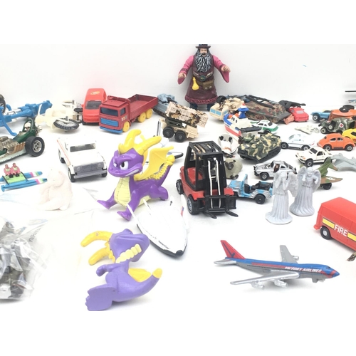 381 - An assorted collection of items including animals, vehicles and figures. NO RESERVE