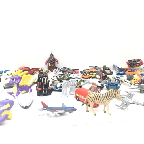 381 - An assorted collection of items including animals, vehicles and figures. NO RESERVE